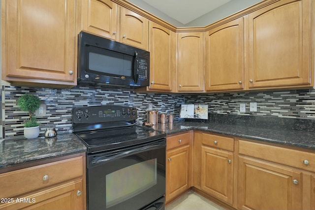 kitchen with dark stone countertops, decorative backsplash, and black appliances