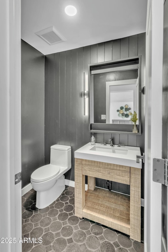 bathroom featuring vanity and toilet