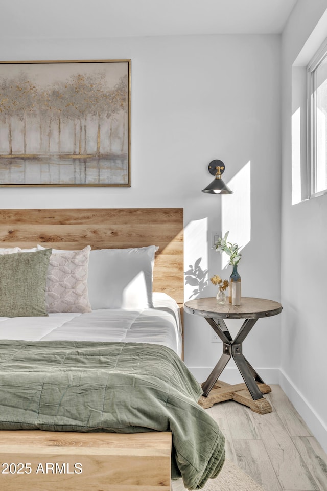 bedroom featuring wood-type flooring