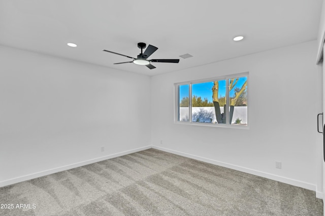 empty room with carpet and ceiling fan