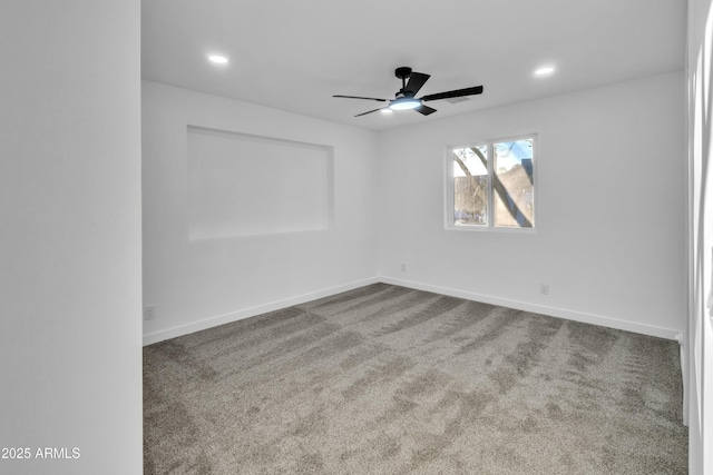 empty room with carpet and ceiling fan