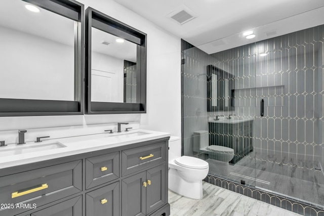 bathroom with walk in shower, vanity, and toilet