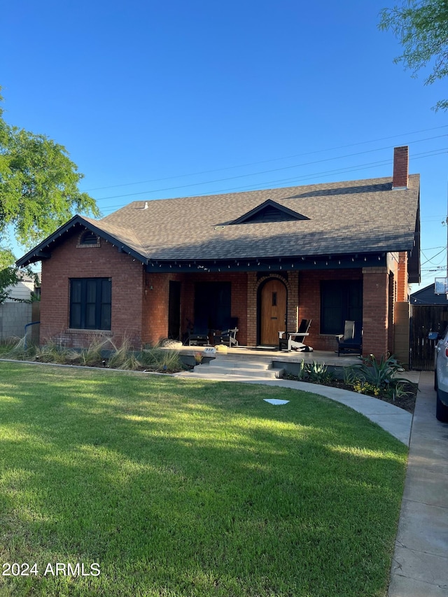 ranch-style home with a front yard