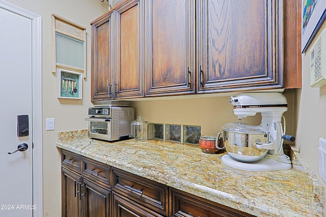 kitchen featuring light stone countertops