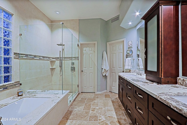 bathroom with vanity and plus walk in shower