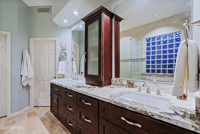 bathroom with walk in shower and vanity