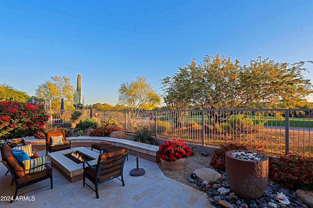 view of patio featuring an outdoor fire pit