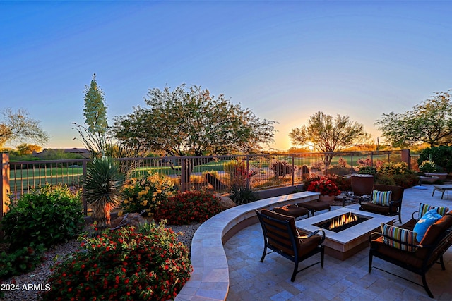 patio terrace at dusk with a fire pit