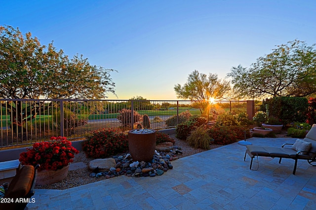 view of patio terrace at dusk