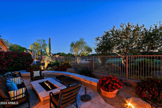 view of patio / terrace with an outdoor fire pit