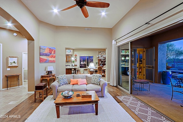 living room with hardwood / wood-style flooring and ceiling fan