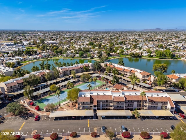 bird's eye view featuring a water view and a residential view