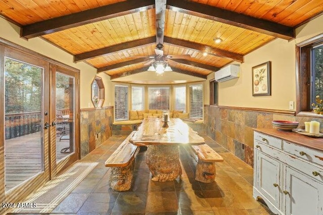 dining area featuring a wealth of natural light, wood ceiling, and tile walls