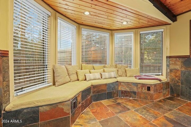 sitting room featuring vaulted ceiling and wooden ceiling