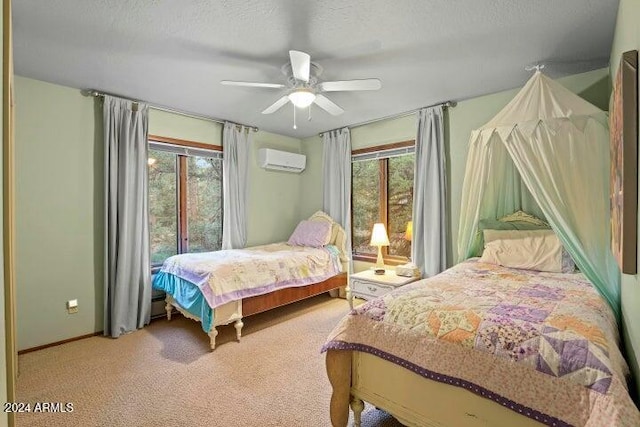 carpeted bedroom with ceiling fan, an AC wall unit, a textured ceiling, and multiple windows