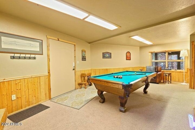 playroom featuring wood walls, carpet floors, a textured ceiling, and pool table