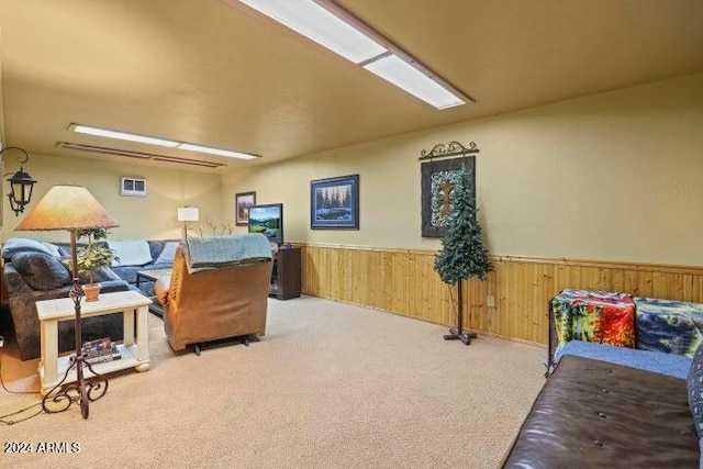 office featuring carpet flooring and wooden walls