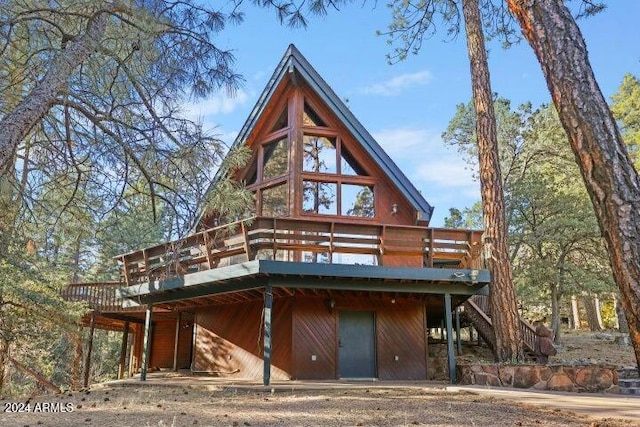 view of front facade with a wooden deck