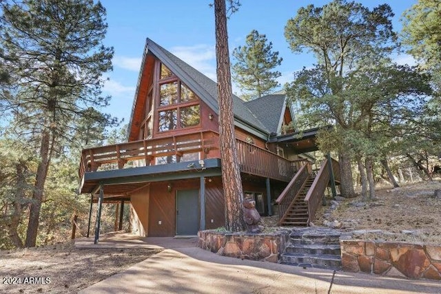 log cabin featuring a deck