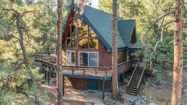 rear view of property with a patio area and a deck