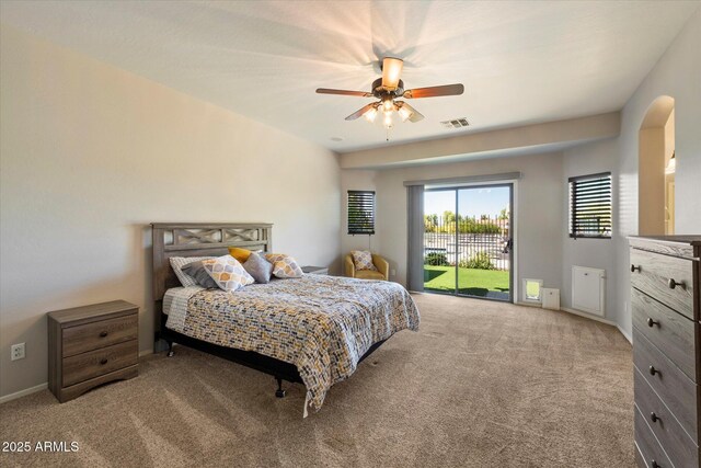 bedroom with visible vents, baseboards, carpet, a ceiling fan, and access to outside