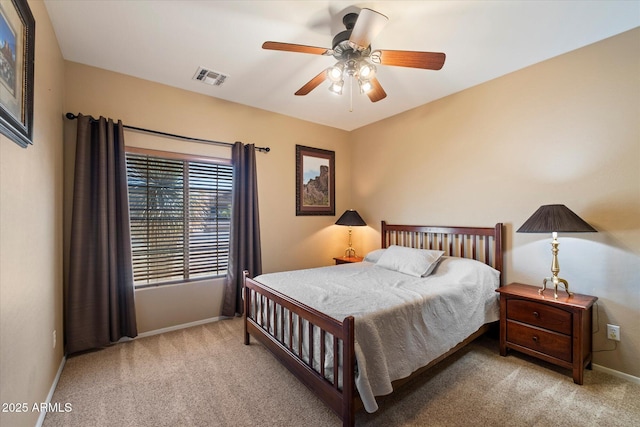 bedroom with carpet, visible vents, a ceiling fan, and baseboards