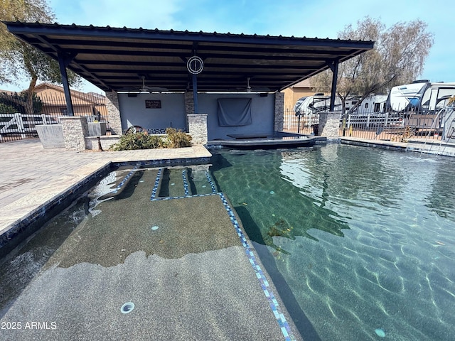 pool featuring a patio and fence