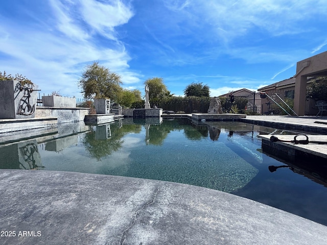 view of pool with fence
