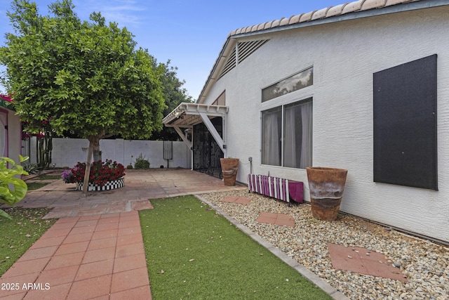 view of yard with fence and a patio area