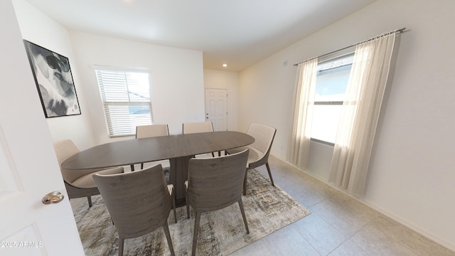 dining area with light tile patterned floors