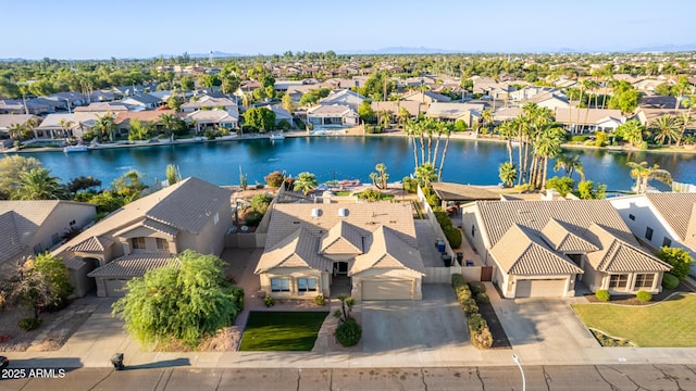 bird's eye view featuring a residential view and a water view