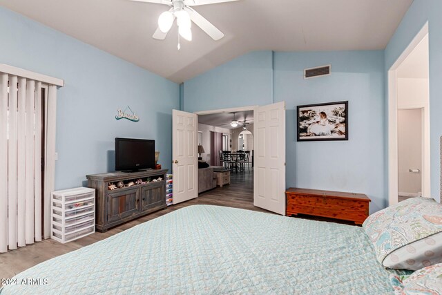 bedroom featuring vaulted ceiling, hardwood / wood-style flooring, and ceiling fan