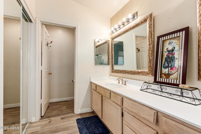 bathroom featuring vanity and hardwood / wood-style flooring