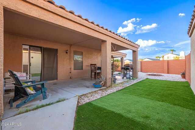 exterior space with a lawn and a patio