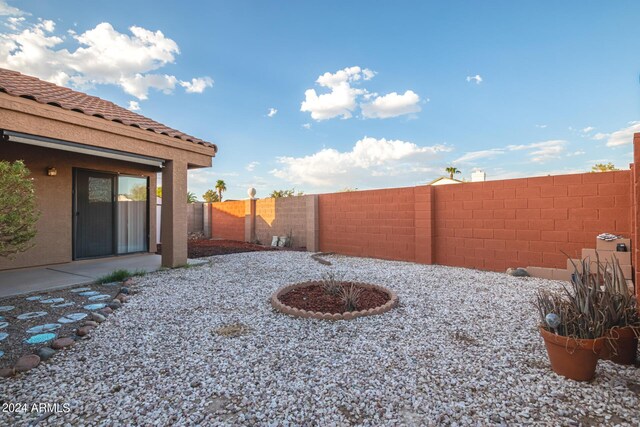 view of yard with an outdoor fire pit and a patio area