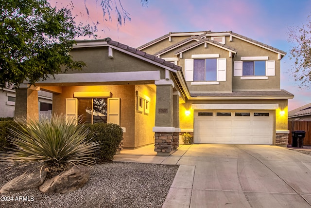 view of front of property with a garage