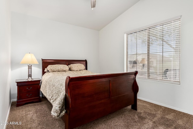 bedroom featuring baseboards, vaulted ceiling, and dark colored carpet