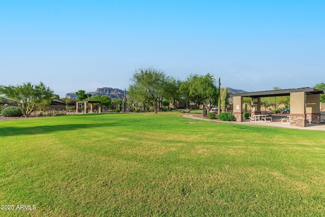 view of yard with a mountain view and a gazebo