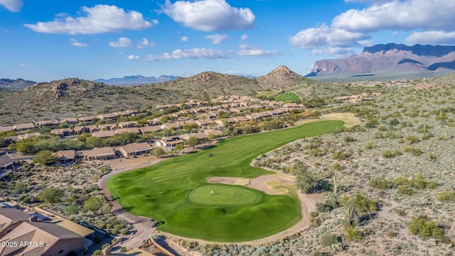 birds eye view of property featuring view of golf course, a residential view, and a mountain view