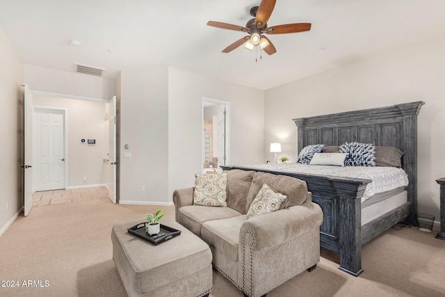 bedroom featuring light carpet and ceiling fan