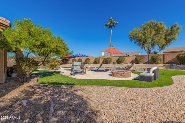 view of playground with a fire pit and a patio