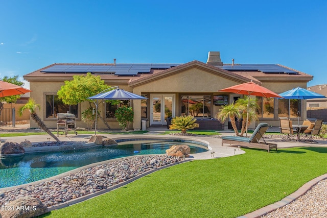 view of pool featuring a yard and a patio area