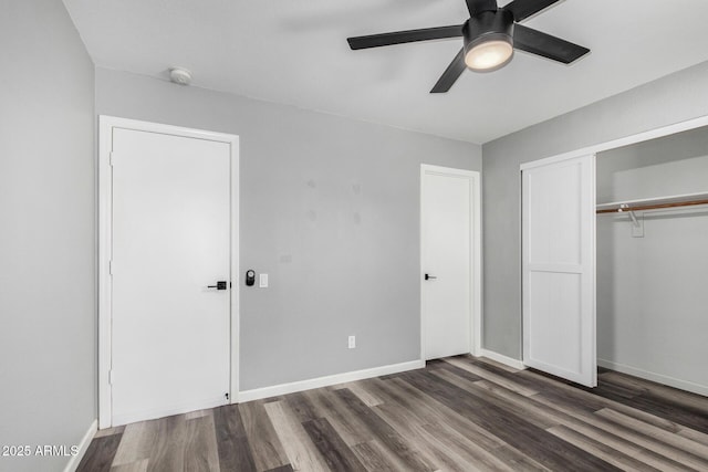 1180 W Rosal Ave, Apache Junction, AZ 85120 - unfurnished bedroom with dark wood-style floors, a closet, and baseboards