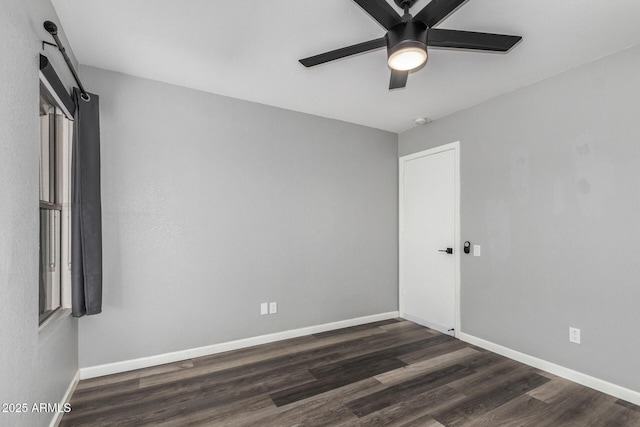 1180 W Rosal Ave, Apache Junction, AZ 85120 - empty room featuring dark wood-type flooring, a ceiling fan, and baseboards