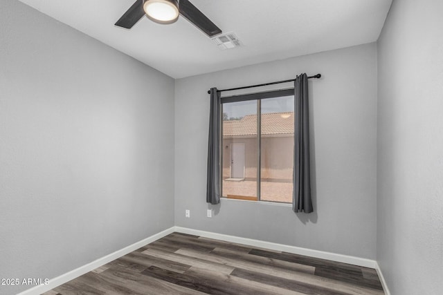 1180 W Rosal Ave, Apache Junction, AZ 85120 - spare room with a ceiling fan, dark wood finished floors, and baseboards