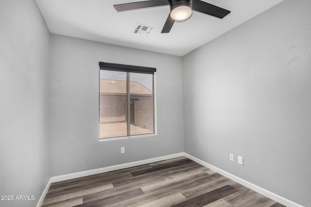 1180 W Rosal Ave, Apache Junction, AZ 85120 - empty room with ceiling fan, wood finished floors, and baseboards