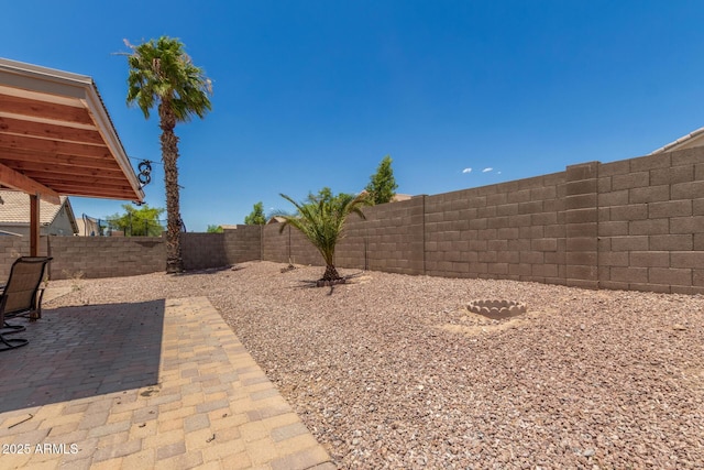 1180 W Rosal Ave, Apache Junction, AZ 85120 - fenced backyard with a patio