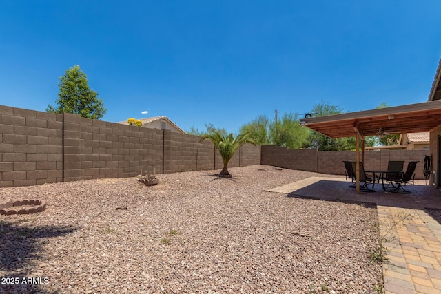 1180 W Rosal Ave, Apache Junction, AZ 85120 - fenced backyard featuring a patio area