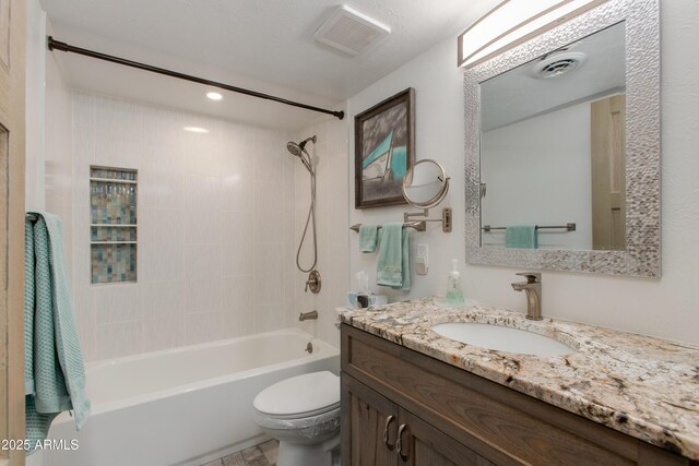 6840 E 2nd St Unit 23, Scottsdale, AZ 85251 - bathroom with shower / washtub combination, toilet, vanity, and recessed lighting