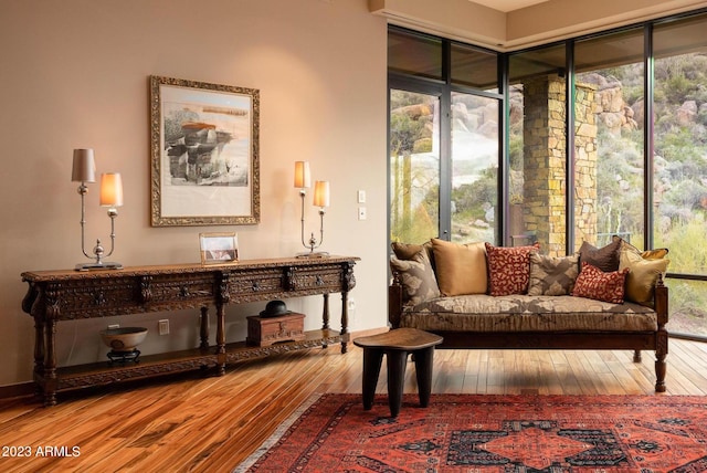 sitting room with hardwood / wood-style flooring